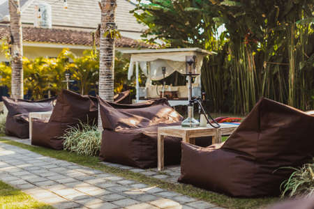 Shisha bar with a sitting bag. Lounge place. hookah in interior. summer time.の写真素材