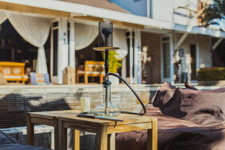 Shisha bar with a sitting bag. Lounge place. hookah in interior. summer time.の写真素材