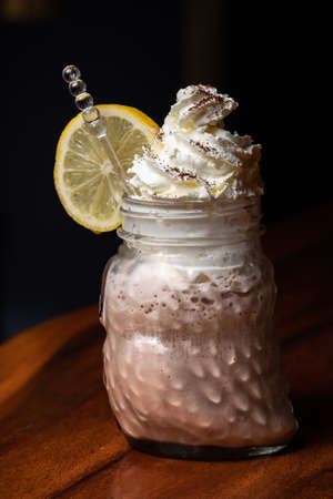Chocolate smoothie in jars for healthy breakfast, milkshake, iced coffee with milk, latte macchiato...