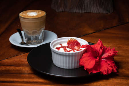Traditional italian dessert vanilla panna cotta with fresh strawberries, coffeeの写真素材