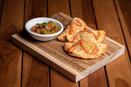 Traditional Spanish tapas with tomato sauce. Fried meat pies.の写真素材