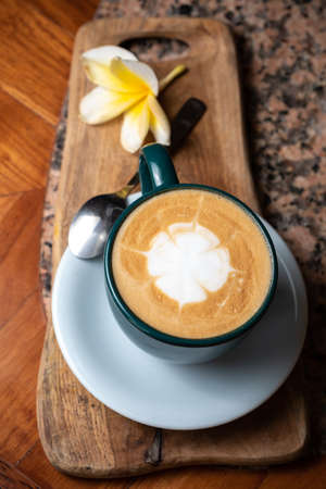 Coffee cup on stone kitchen table. Cappuccino, hot latte or coffee with milk.の写真素材