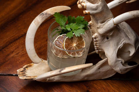 Sweet lemon iced tea cocktail on the dark wood table.の写真素材