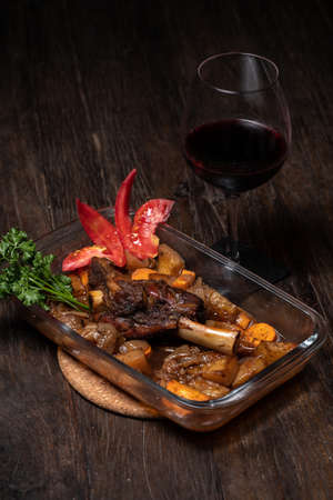 Roasted lamb leg with potatoes fresh oven cooked. Delicious roasted ribsの写真素材