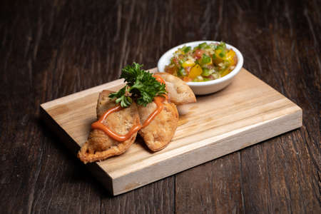 Traditional Spanish tapas with tomato sauce. Fried meat pies.の写真素材