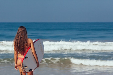 Healthy Active Lifestyle. Surfing. Water Sports. Beautiful Athletic Surfer Woman With Sexy Fit Body...