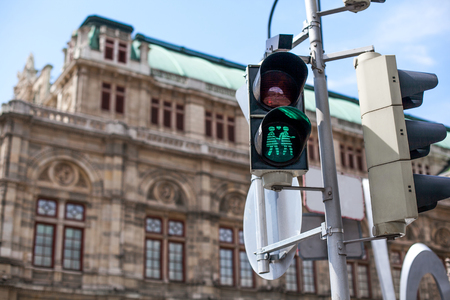 Traffic lights with the green light lit with two woman on love. Homosexual couple in love on sign. Concept of tolerance and free love in Vienna.の写真素材