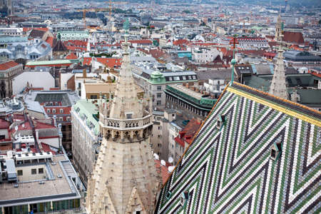 Detail of Colorful Tiles and One Small Window on Roof of the from St. Stephen's Cathedral in Vienna, Austriaの写真素材