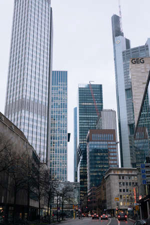 FRANKFURT-AM-MAIN, GERMANY - MARCH 2020: Skyscrapers in financial district in fog rainy day. Skyline of big modern city.のeditorial素材
