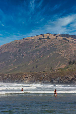 Surfing, hiking and sunbathing at Sand Dollar State Beach in Big Sur Californiaの写真素材