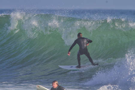 Surfing in Rincon in Californiaの写真素材