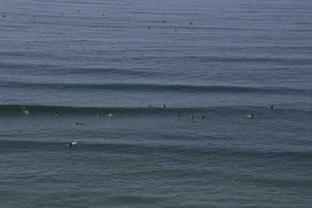 Surfing at Sand Dollar beach in Big Sur California