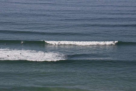 Surfing at Sand Dollar beach in Big Sur