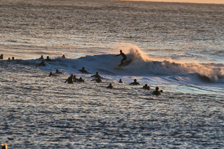 Surfing big waves in the Santa Barbara Harborの写真素材