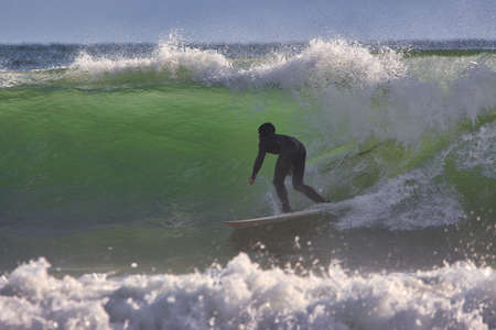 Surfing winter waves at Rincon point in Californiaの写真素材