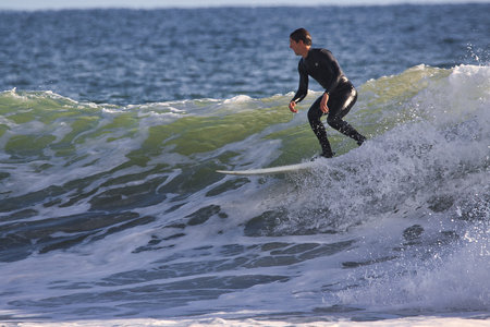 Surfing winter waves at Rincon point in Californiaの写真素材