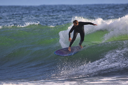 Surfing winter waves at Rincon point in California