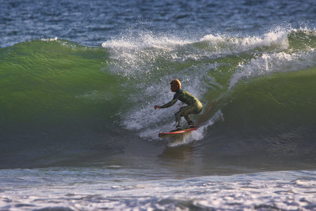 Surfing winter waves at Rincon point in Californiaの写真素材