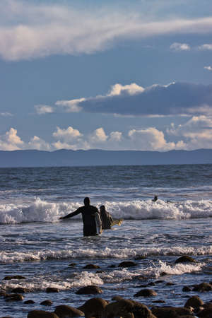Surfing winter waves at Rincon point in California