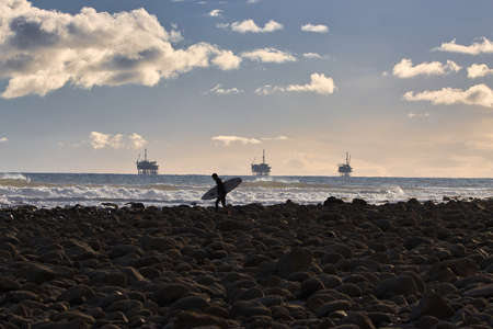 Surfing winter waves at Rincon point in Californiaの写真素材