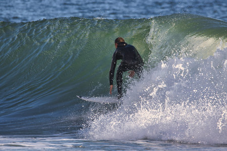Surfing winter waves at Rincon point in California