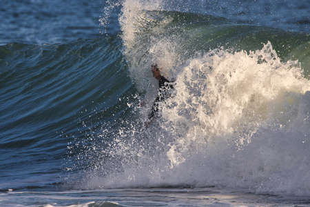 Surfing winter waves at Rincon point in California