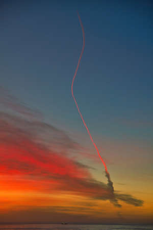 Missile launch at sunset from Vandenberg Air Force base