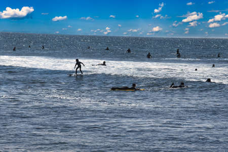 surfing summer waves in Malibuの写真素材