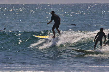surfing summer waves in Malibuの写真素材