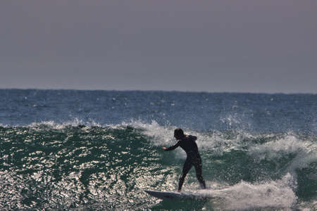 surfing summer waves in Malibu