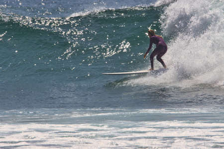 Surfing summer waves in Malibu