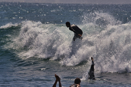 Surfing summer waves in Malibuの写真素材