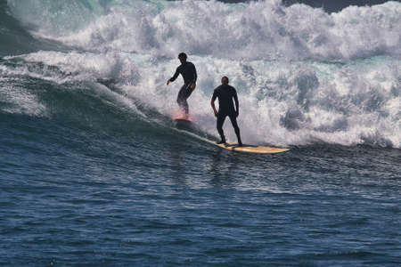 Surfing summer waves at Malibu California