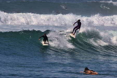 Surfing summer waves at Malibu California