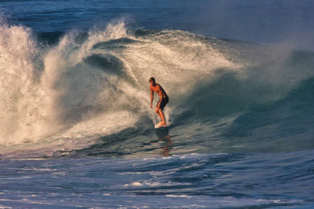 Surfing giant waves at Pipeline Hawaii