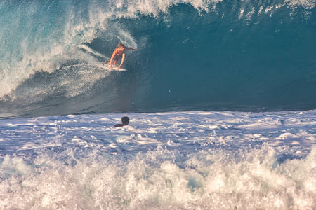 Surfing giant waves at Pipeline Hawaii