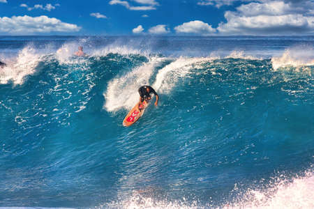 Surfing giant waves at Pipeline Hawaii