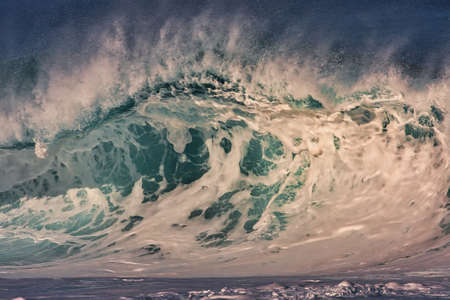 Surfing giant waves at Pipeline on the north shore Oahu Hawaii