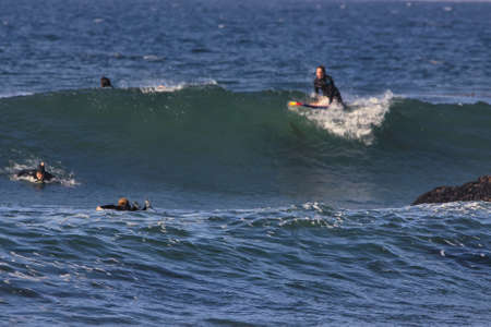 Surfing summer waves at Leo Carrillo state beachのeditorial素材
