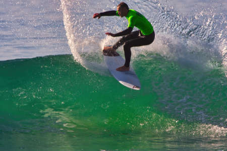 Surfing in the Rincon Classic surfing contest 01-18-2014