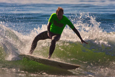 Surfing the Rincon Classic surfing contest in 2014