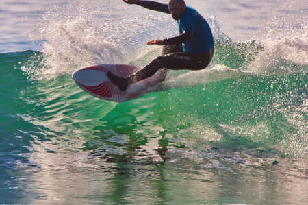 Surfing the Rincon Classic surfing contest in 2014