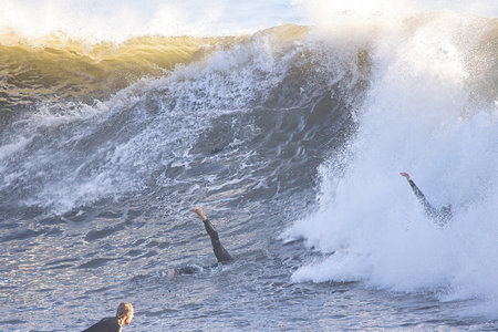 Surfer in action at the beach on a beautiful sunny day.の写真素材