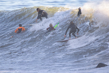 Surfing Rincon point in California on a sunny winter day.