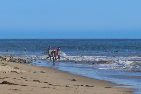 Surfers on the beach in San Jose, CA, USA.の写真素材