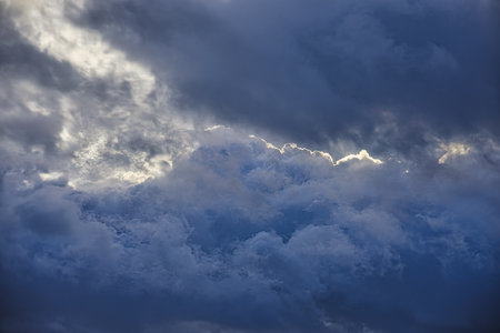 The vast blue sky and clouds.