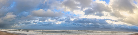 Panoramic view of stormy Baltic sea. Dramatic cloudscape.の写真素材