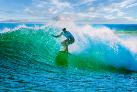 Surfer on Blue Ocean Wave, Bali island, Indonesia.の写真素材