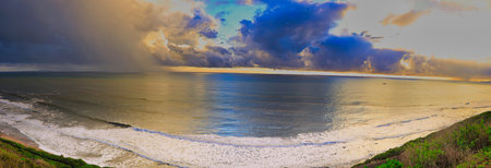 Panorama of the ocean at sunset. Panoramic view of the beach at sunset.
