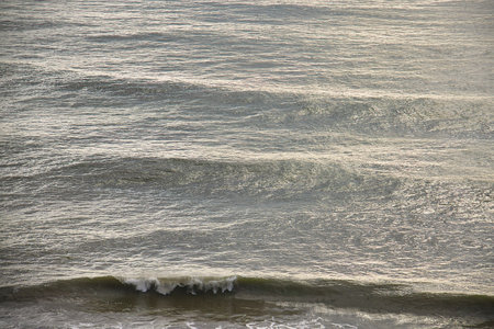 Waves on the sea in the evening light. Natural background.
